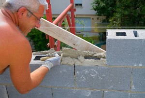 Mason performs an external masonry blocks concrete